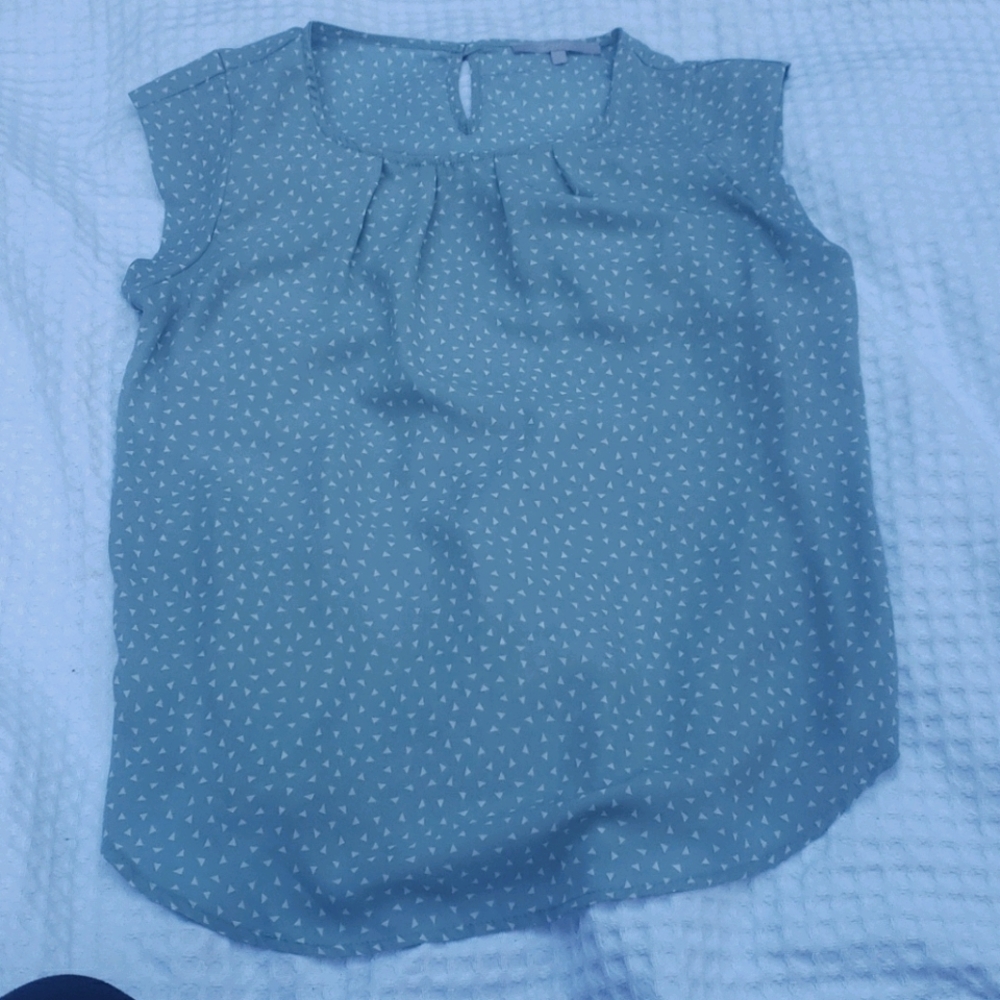 Baby blue blouse with white triangle pattern